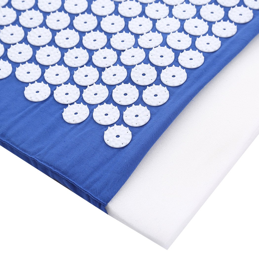 Acupressure mat with white spikes.