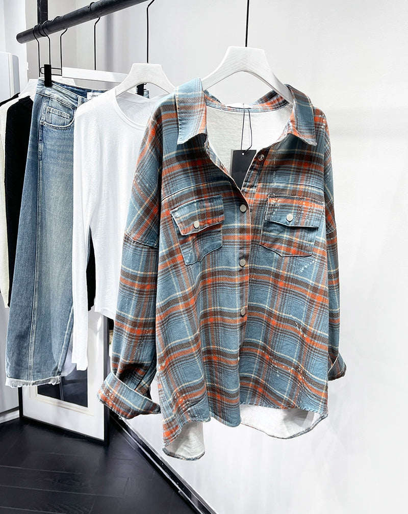 A stylish plaid shirt featuring a loose fit, designed for comfort and a youthful appearance, available in various colors.