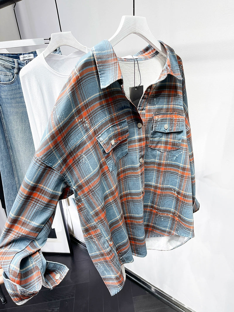 A stylish plaid shirt featuring a loose fit, designed for comfort and a youthful appearance, available in various colors.