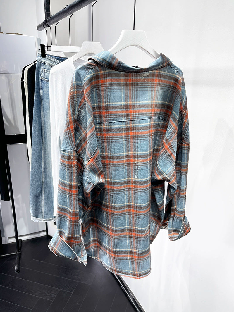 A stylish plaid shirt featuring a loose fit, designed for comfort and a youthful appearance, available in various colors.