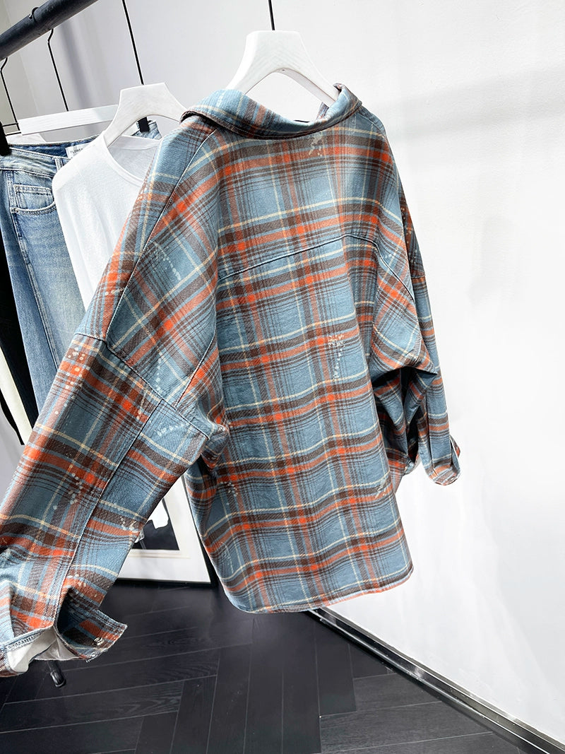 A stylish plaid shirt featuring a loose fit, designed for comfort and a youthful appearance, available in various colors.