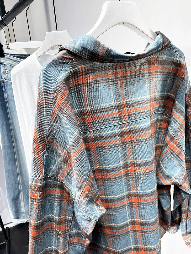 A stylish plaid shirt featuring a loose fit, designed for comfort and a youthful appearance, available in various colors.