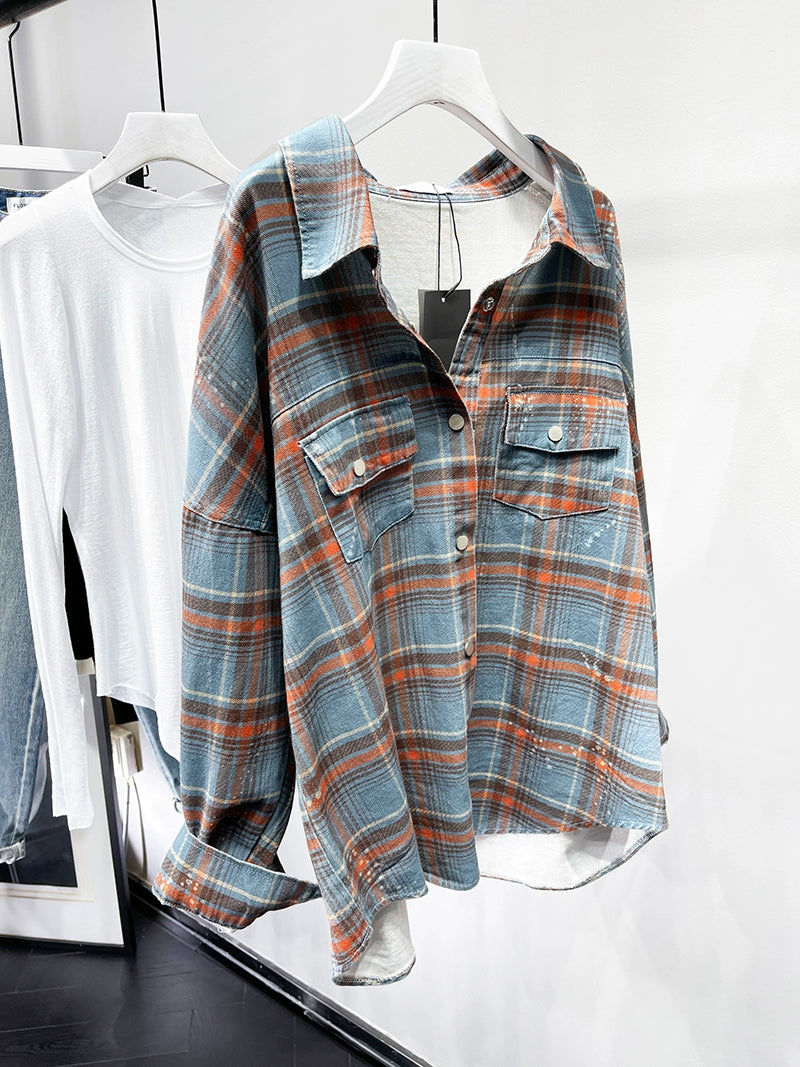 A stylish plaid shirt featuring a loose fit, designed for comfort and a youthful appearance, available in various colors.