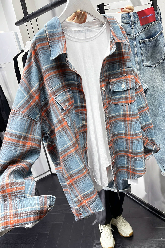 A stylish plaid shirt featuring a loose fit, designed for comfort and a youthful appearance, available in various colors.