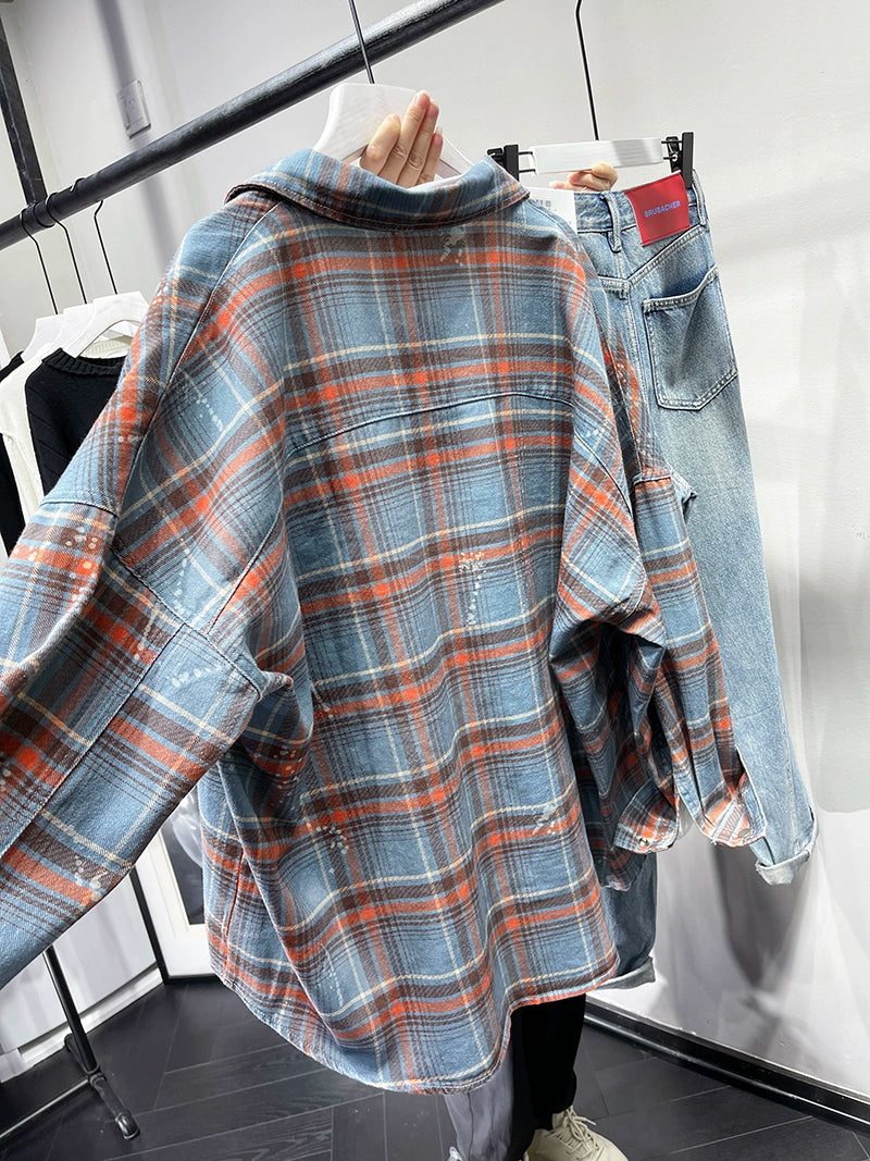 A stylish plaid shirt featuring a loose fit, designed for comfort and a youthful appearance, available in various colors.