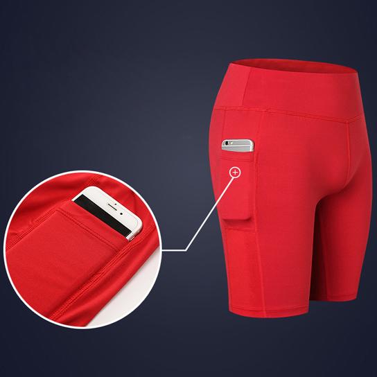 A pair of stretchable All Seasons Yoga Shorts in vibrant colors, featuring an elastic waistband and a convenient phone pocket.