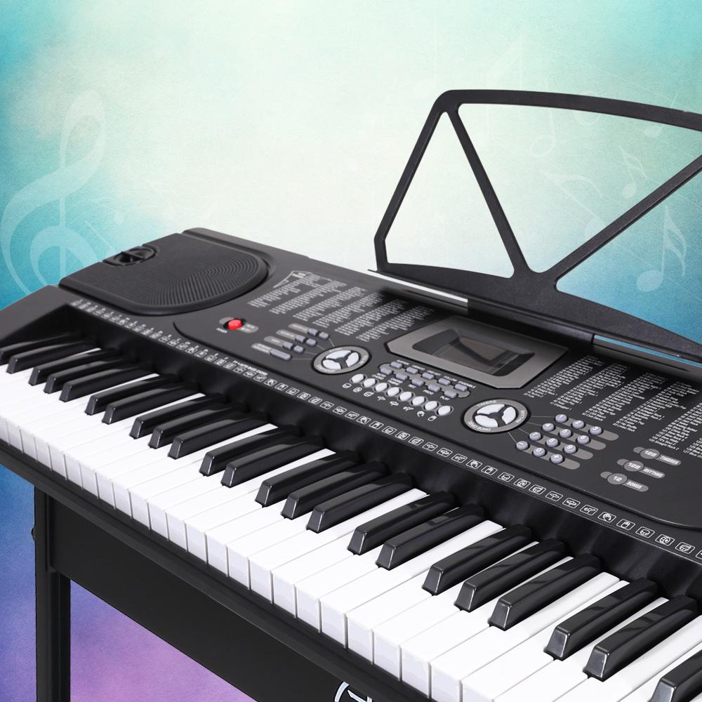 ALPHA 61 Keys LED Electronic Piano Keyboard with adjustable stand and music sheet holder, showcasing its sleek black design and LED display.