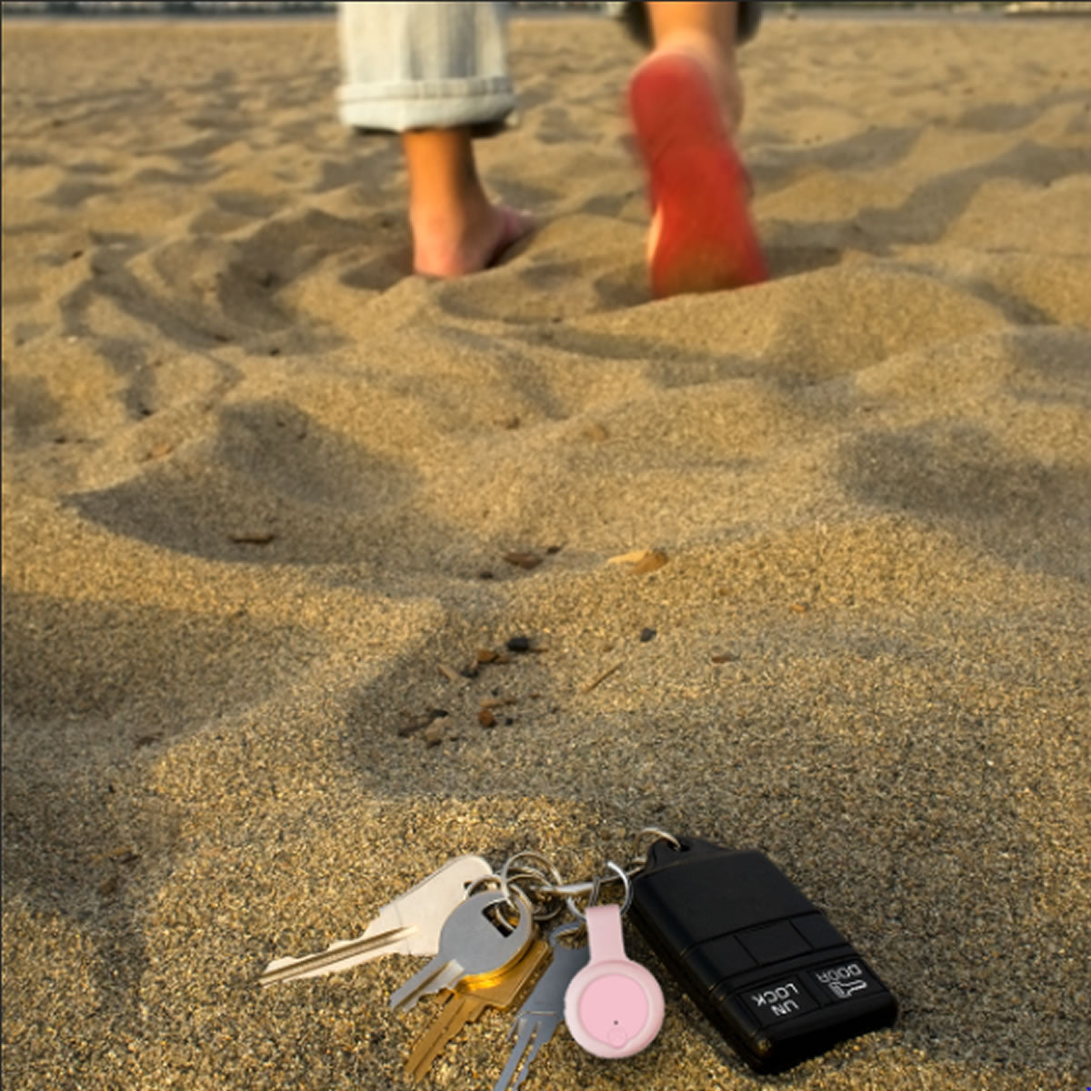 Two Anti Lost Devices in various colors, designed to help locate lost items easily with a remote transmitter.