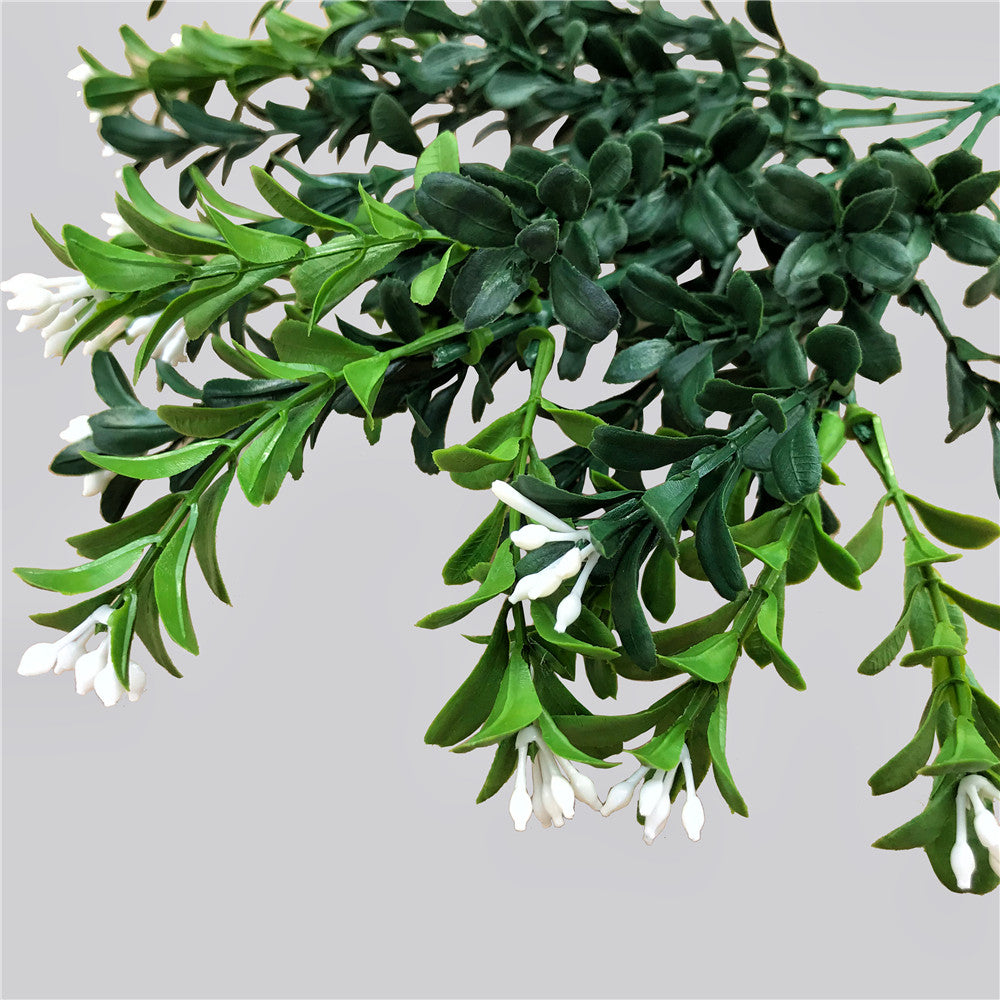 30cm Artificial Flowering Boxwood Stem with realistic foliage and small white flowers, perfect for indoor and outdoor decoration.