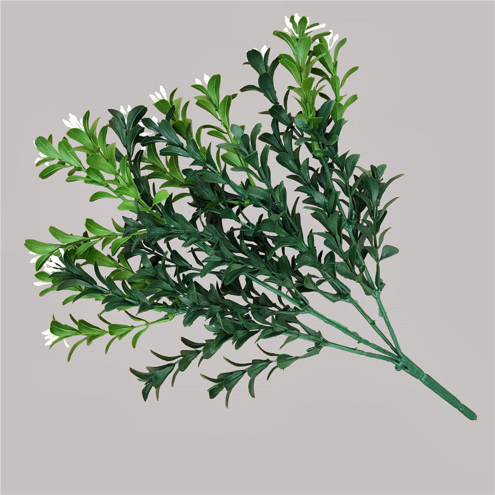 30cm Artificial Flowering Boxwood Stem with realistic foliage and small white flowers, perfect for indoor and outdoor decoration.