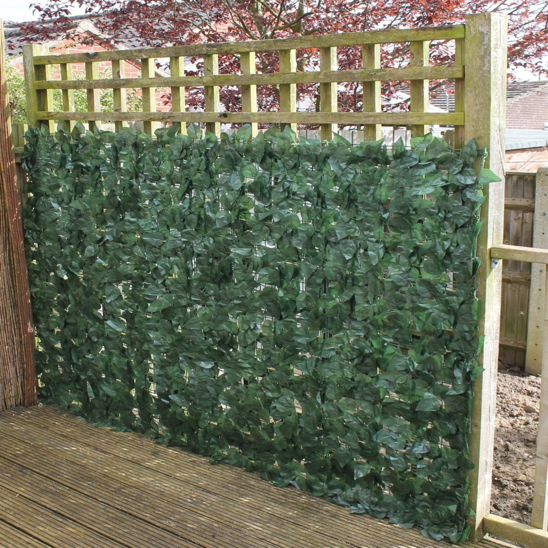 A roll of Artificial Ivy Leaf Hedging measuring 3m x 1m, showcasing lush green leaves ideal for privacy and decoration.