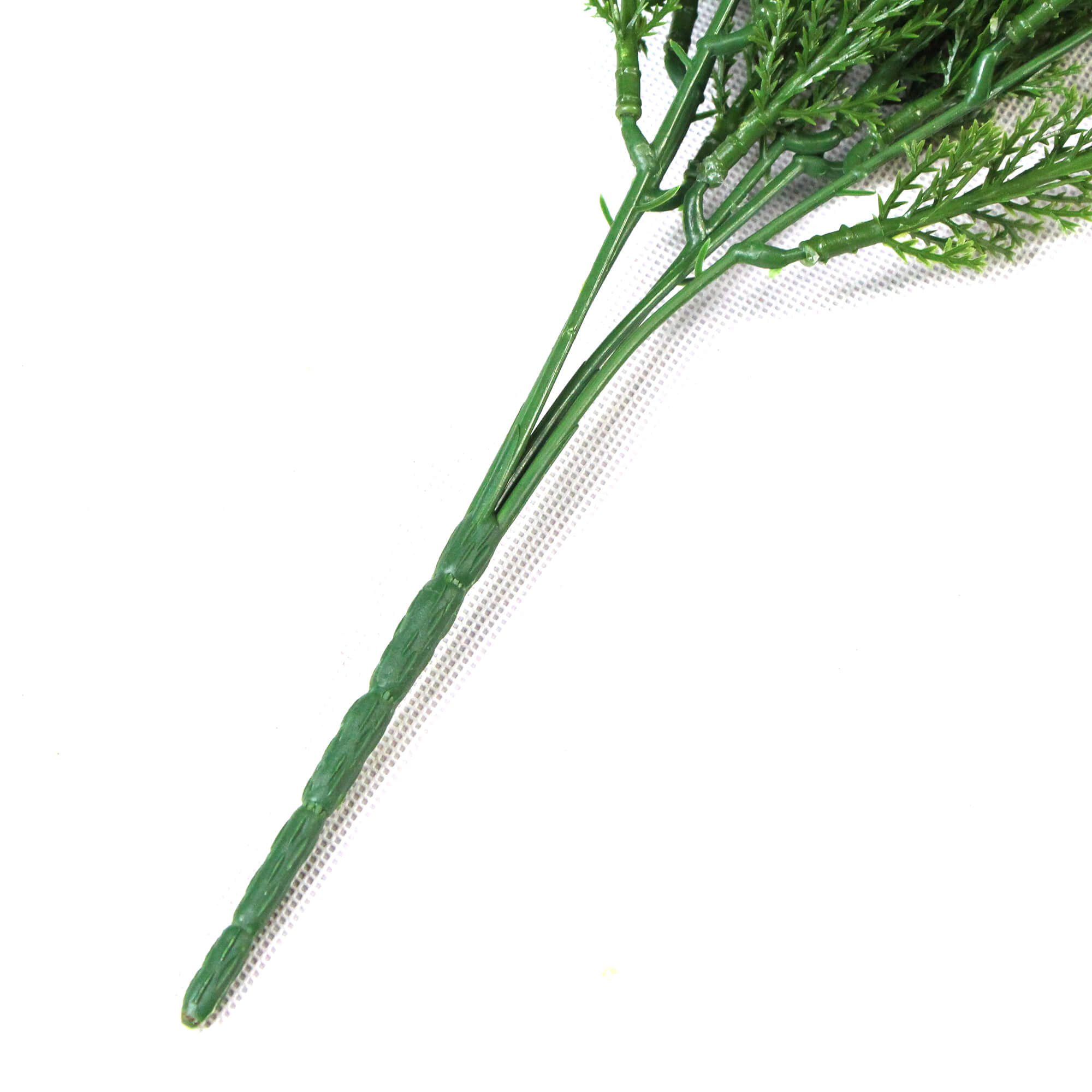 A vibrant 30cm Artificial Long Wild Grass stem, showcasing its UV-resistant features and lush green appearance, perfect for home decor.