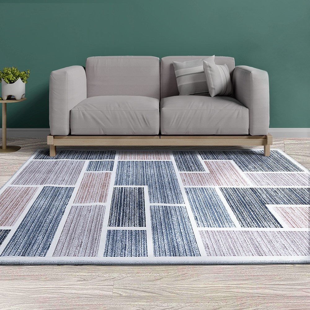 Artiss Short Pile Floor Rug 200x290cm in soft grey, showcasing its plush texture and non-slip backing, perfect for enhancing any room's décor.