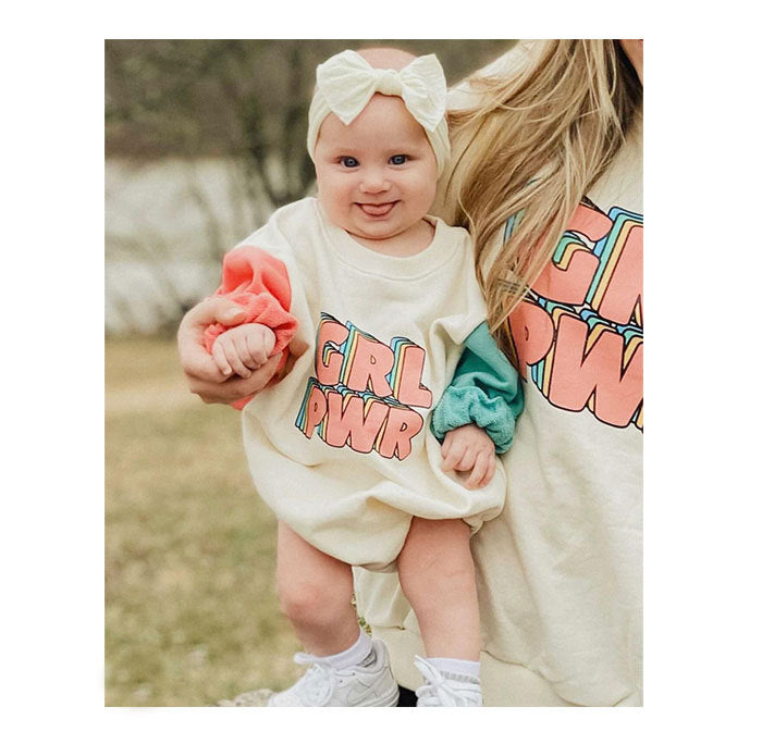 Baby unisex romper featuring color-blocking letters design in beige, suitable for boys and girls aged 3-18 months.