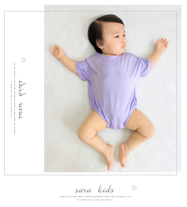 Baby unisex solid color rompers in various colors including pink, blue, green, and yellow, made from soft cotton blend fabric.