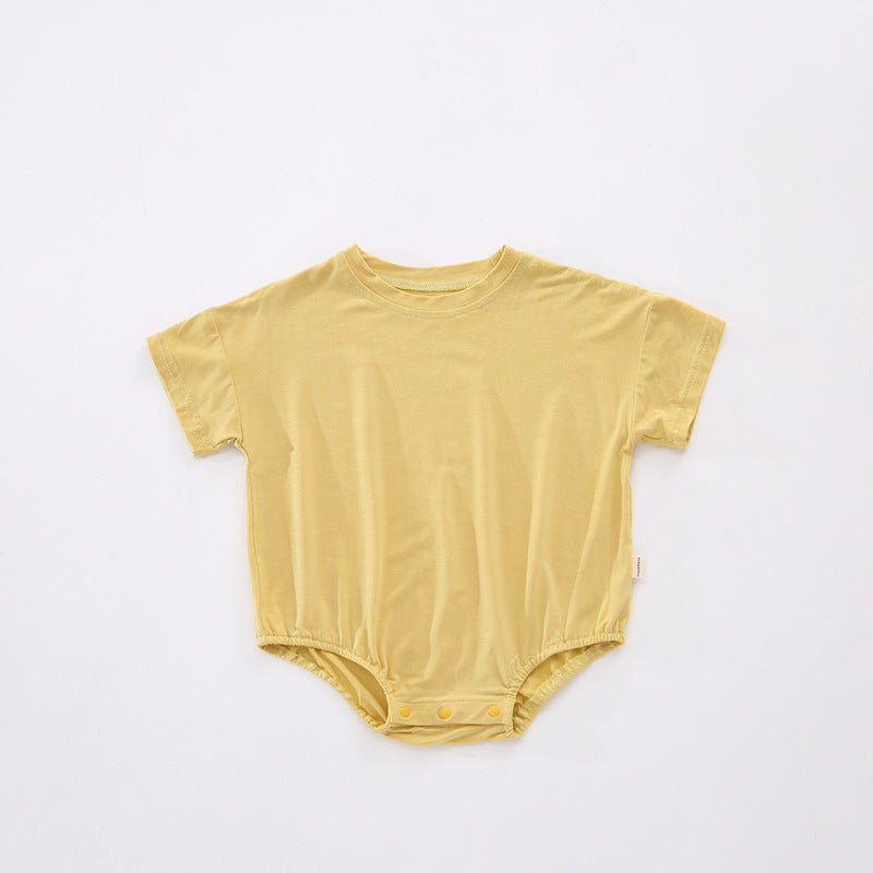 Baby unisex solid color rompers in various colors including pink, blue, green, and yellow, made from soft cotton blend fabric.