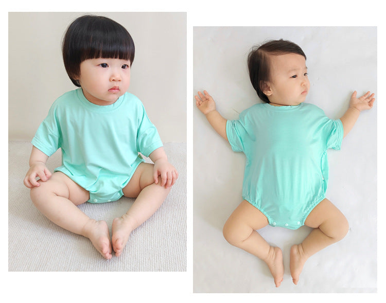 Baby unisex solid color rompers in various colors including pink, blue, green, and yellow, made from soft cotton blend fabric.