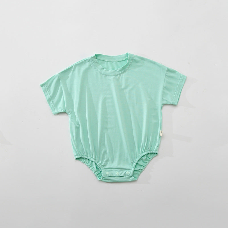 Baby unisex solid color rompers in various colors including white, blue, green, pink, purple, and yellow, made from soft cotton blend fabric.