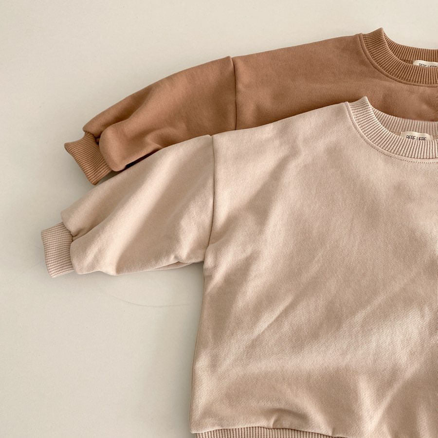 Baby unisex solid color rompers in beige and coffee, made from a soft cotton blend, suitable for boys and girls aged 3-18 months.