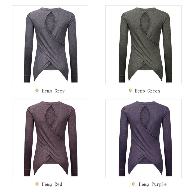 A stylish back open long sleeve training fitness yoga shirt for women, featuring a crew neck and thumb holes, perfect for workouts.