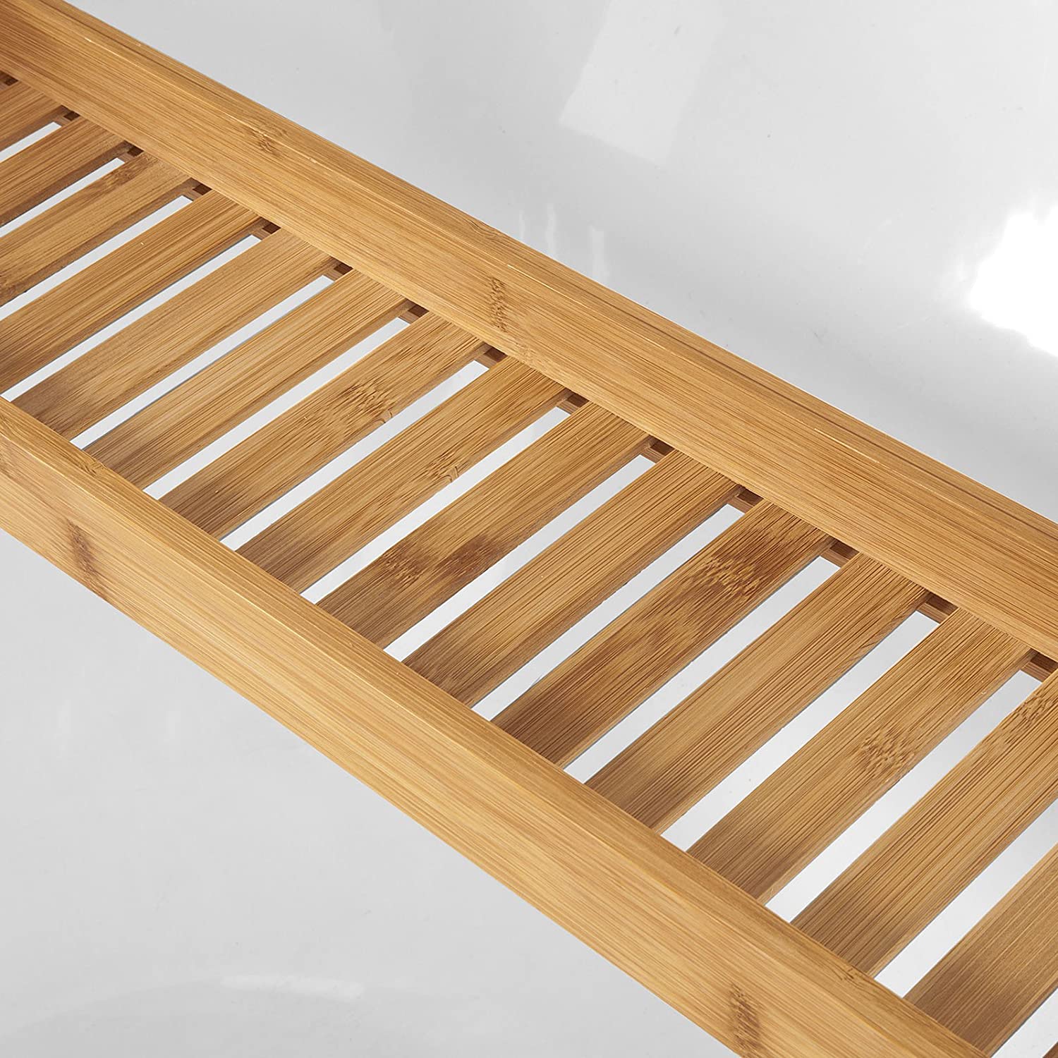 A natural bamboo bath caddy tray organiser, showcasing its sleek design and moisture-resistant finish, ideal for storing bath essentials.