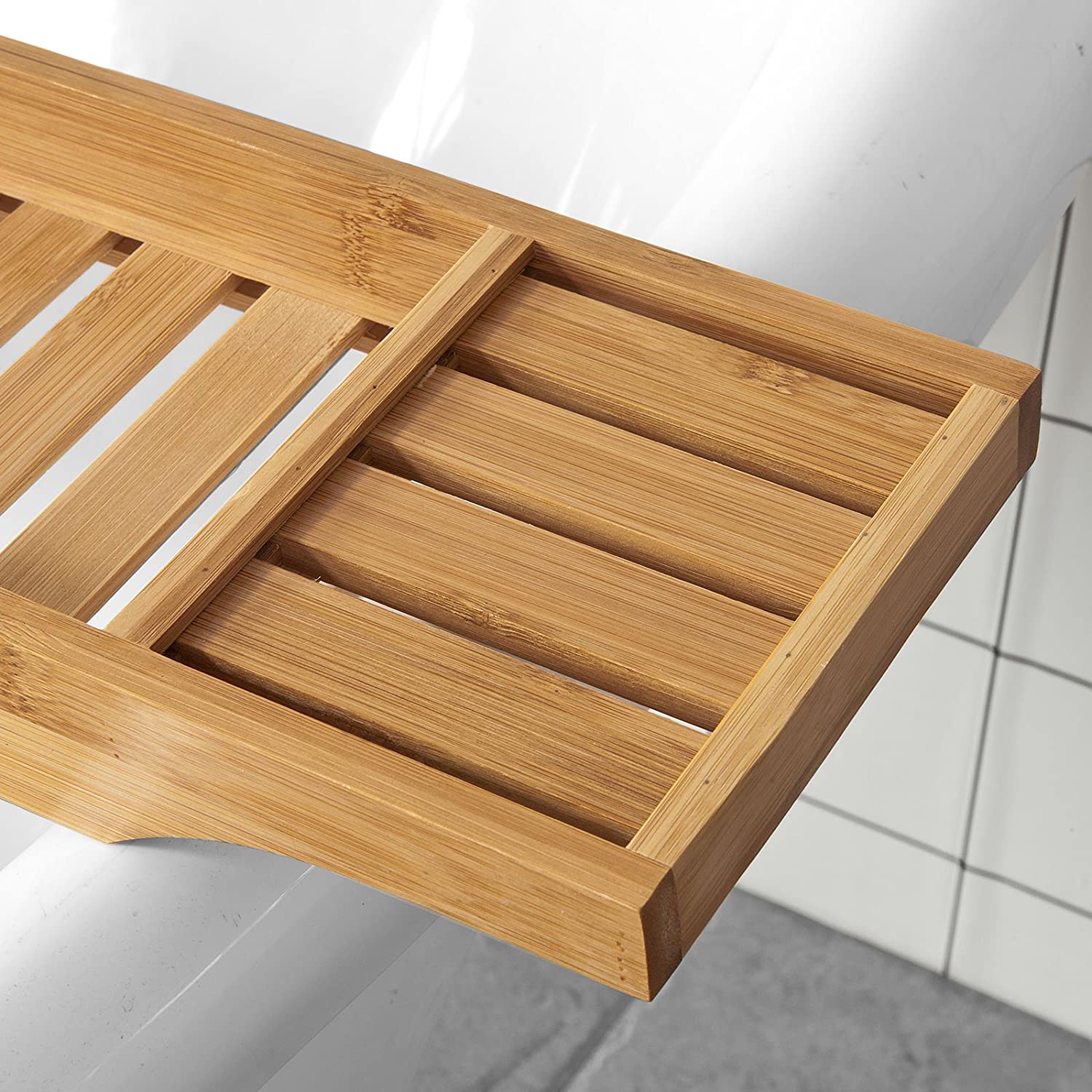 A natural bamboo bath caddy tray organiser, showcasing its sleek design and moisture-resistant finish, ideal for storing bath essentials.