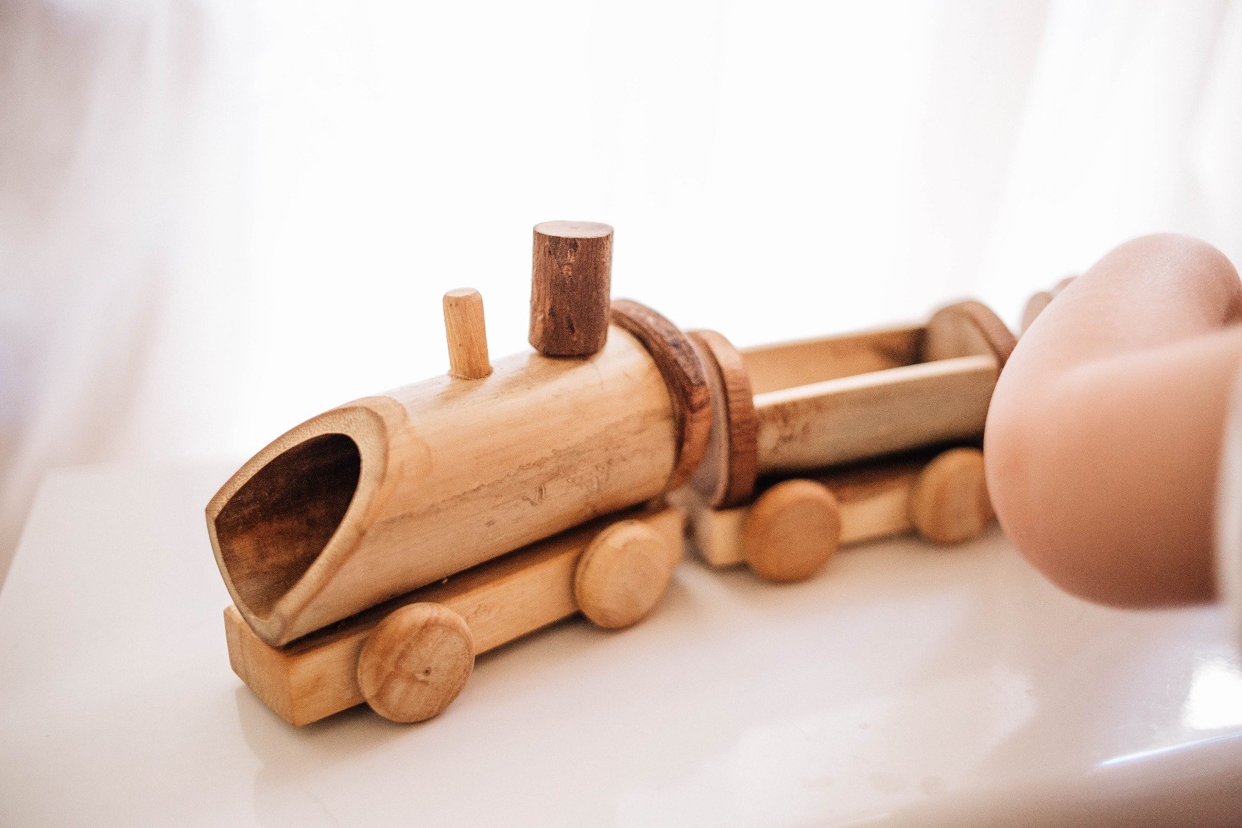 A charming Bamboo Train toy made from eco-friendly bamboo, showcasing its natural finish and lightweight design.