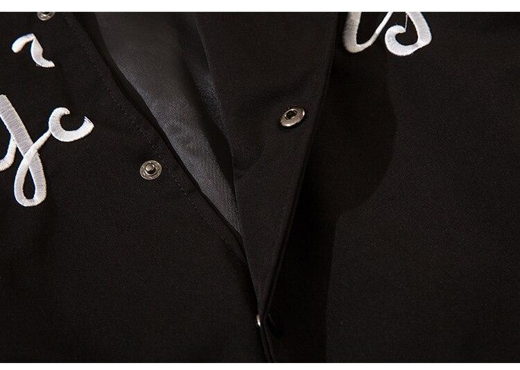 Men's baseball jacket featuring star letter embroidery and patchwork design in black and white colors.