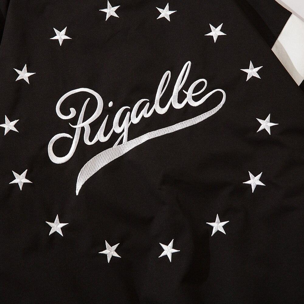 Men's baseball jacket featuring star letter embroidery and patchwork design in black and white colors.