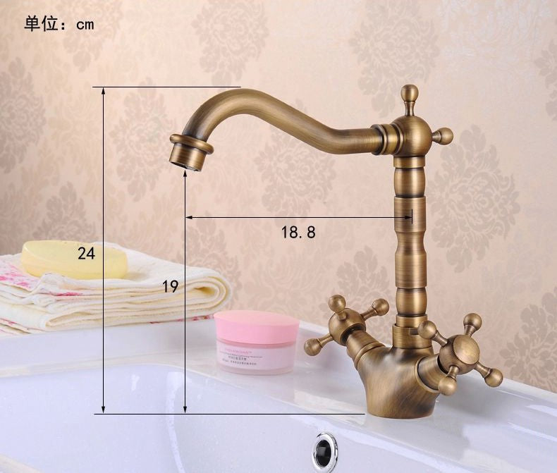 Antique brass bathroom sink faucet with 360-degree swivel spout and dual cross handles, showcasing elegant design and functionality.