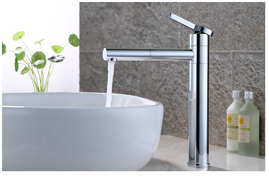 Brass bathroom faucet with a swivel spout and chrome finish, designed for vessel sinks.