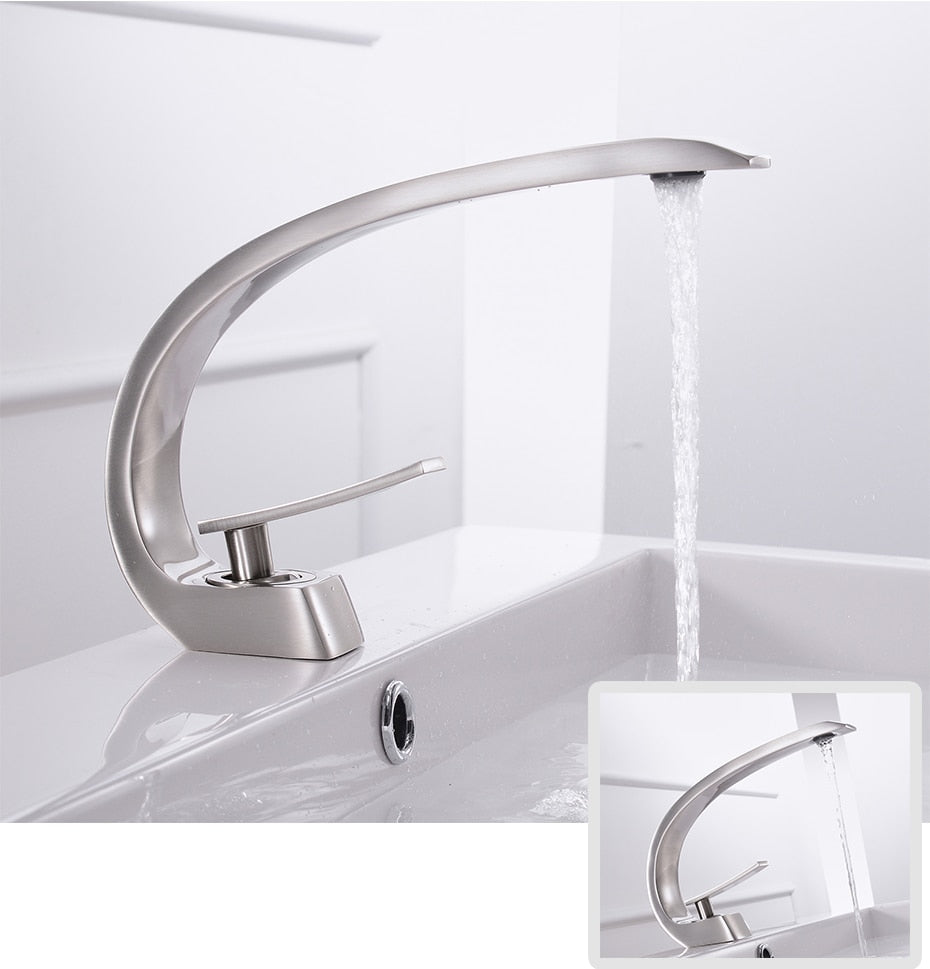 Modern brass basin faucet with single handle and sleek design, available in chrome, brushed nickel, and black finishes.