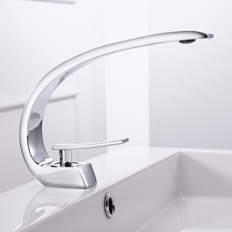 Modern brass basin faucet with single handle and sleek design, available in chrome, brushed nickel, and black finishes.