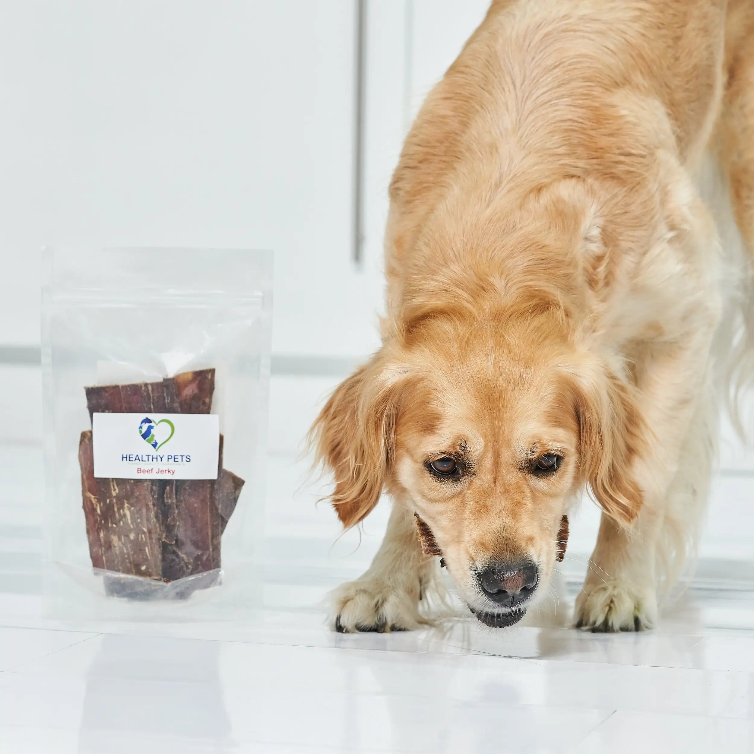 A pack of organic natural beef jerky dog treats, showcasing the chewy texture and rich color of the beef.