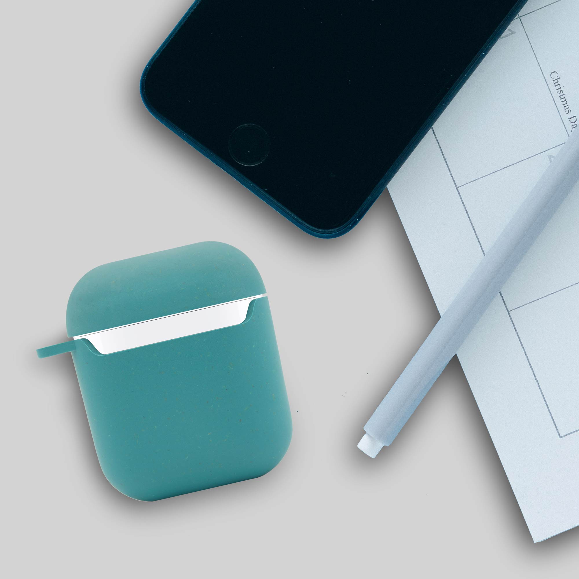 Biodegradable AirPods Case in Ocean Blue, showcasing its eco-friendly design and texture with a natural look.