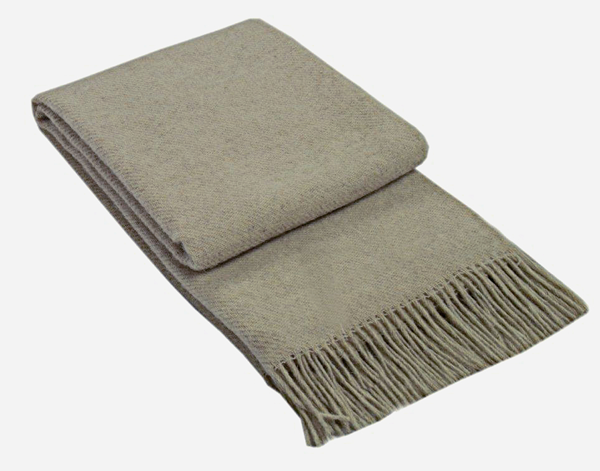 Brighton Throw blanket made from 100% New Zealand wool in beige, showcasing its soft texture and elegant design.