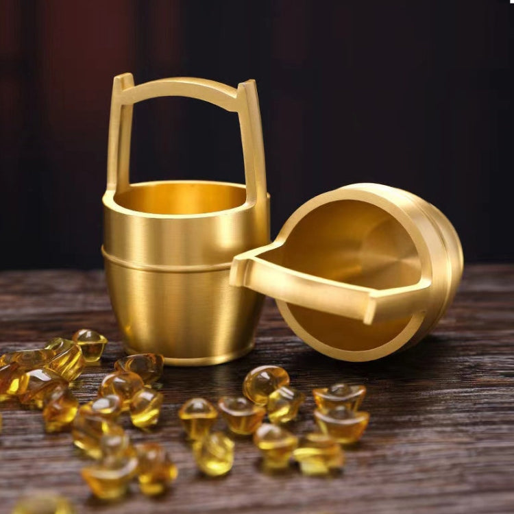 A hand polished brass mini ornament shaped like a bucket, symbolizing wealth and prosperity, perfect for office or home decor.