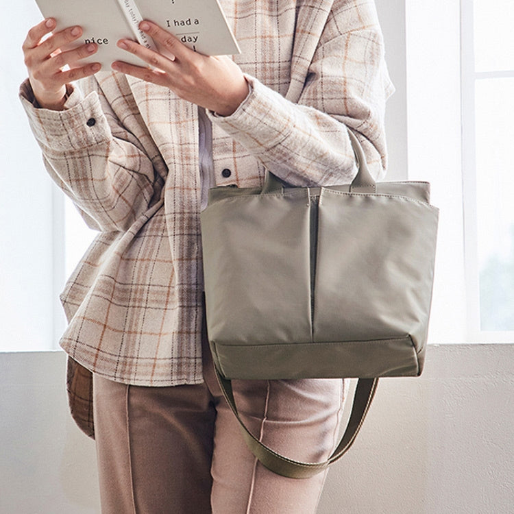 Business Briefcase Handbag in black oxford cloth, showcasing dual-purpose design with shoulder strap and anti-theft magnetic buckle.