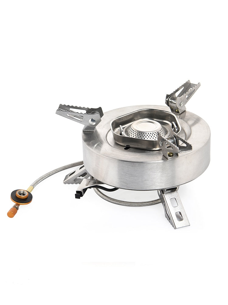 Camping Tourist Burner Gas Stove in outdoor setting, showcasing its portable design and aluminum alloy construction.