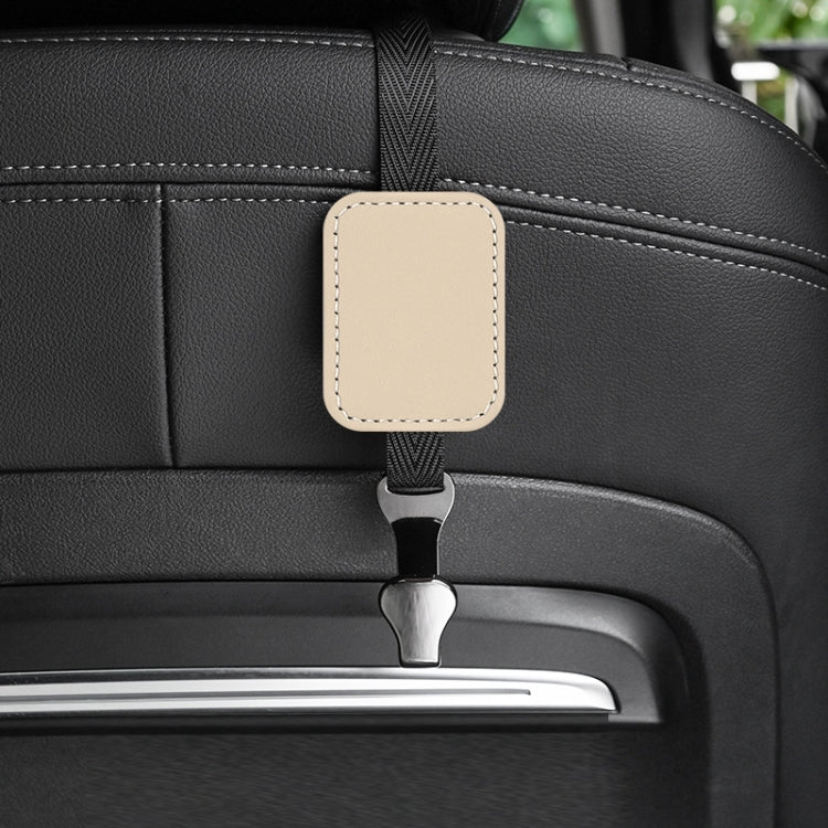 Beige suede multifunctional hook for car rear seat backrest, showcasing its durable design and compact size.