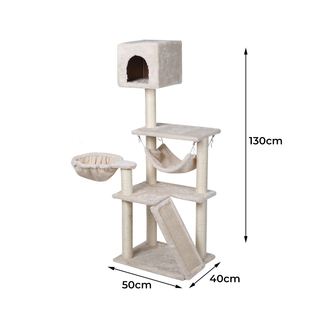 A beige multi-level cat tree tower with plush covering, sisal scratching posts, and hanging toys, designed for playful cats.