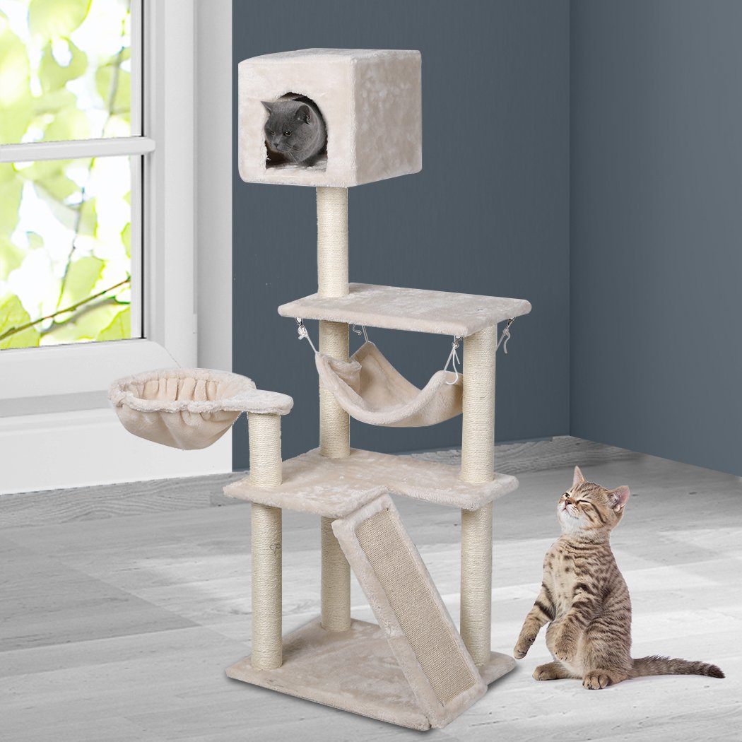 A beige multi-level cat tree tower with plush covering, sisal scratching posts, and hanging toys, designed for playful cats.