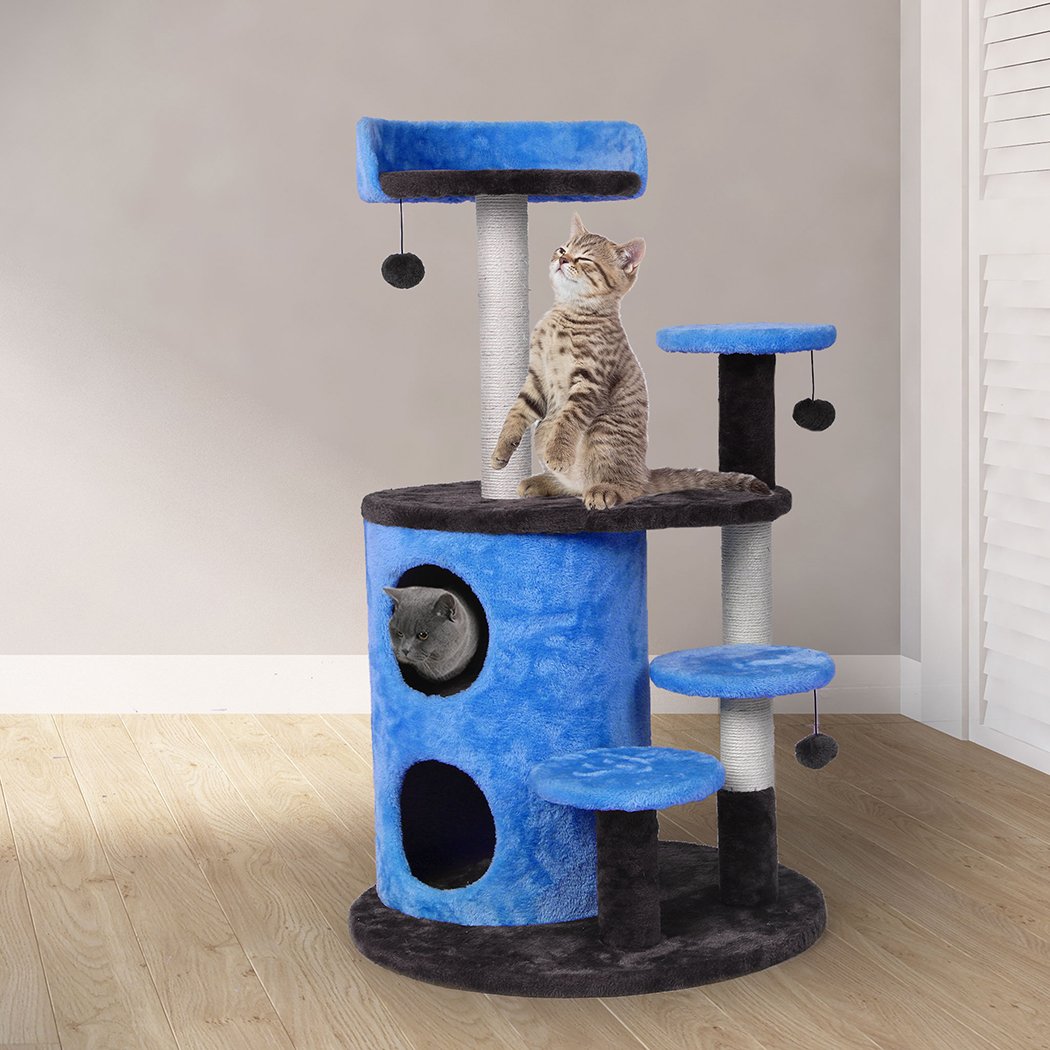 A multi-level cat tree tower with plush covering, sisal scratching post, and hanging toys, designed for playful cats.