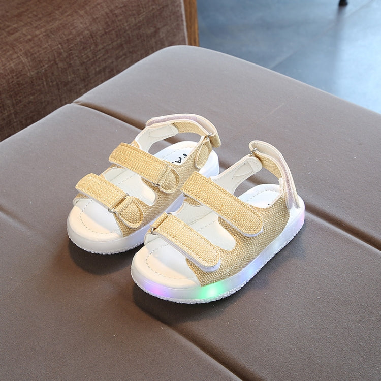 Children's LED light-up beach shoes with soft soles, featuring breathable artificial leather and nylon straps, perfect for summer fun.