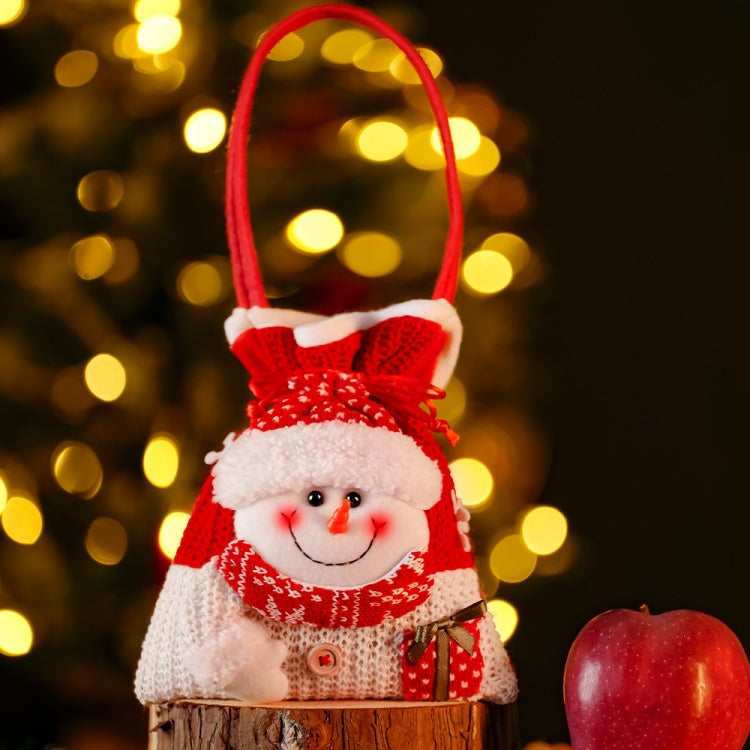 Christmas knitted handheld gift bag for children featuring a cute cartoon design, made from soft flannel and linen, perfect for candies and small gifts.