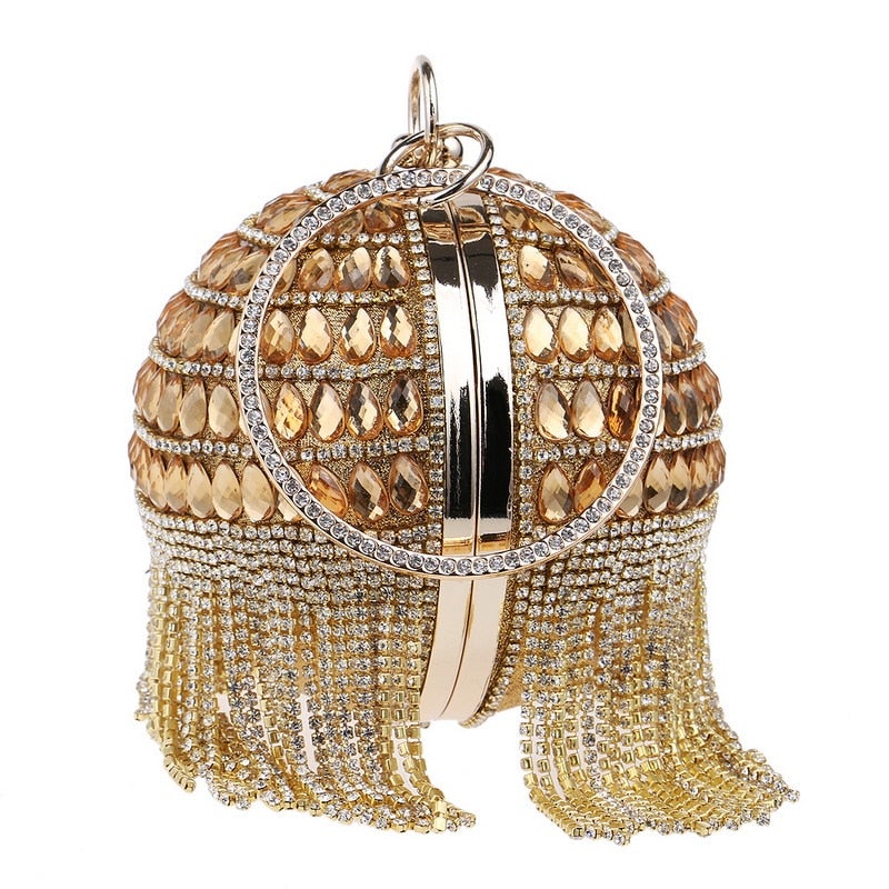 Circular women clutch with tassels and rhinestones, featuring a stylish design and chain shoulder strap, perfect for evening events.