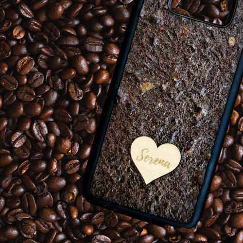 Personalized Coffee phone case featuring a wooden heart with custom text engraving, showcasing a unique and eco-friendly design.