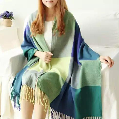 COLORAMA Reversible Shawl featuring vibrant colors and unique square patterns, with delicate fringes at the hemline, perfect for cozy styling.