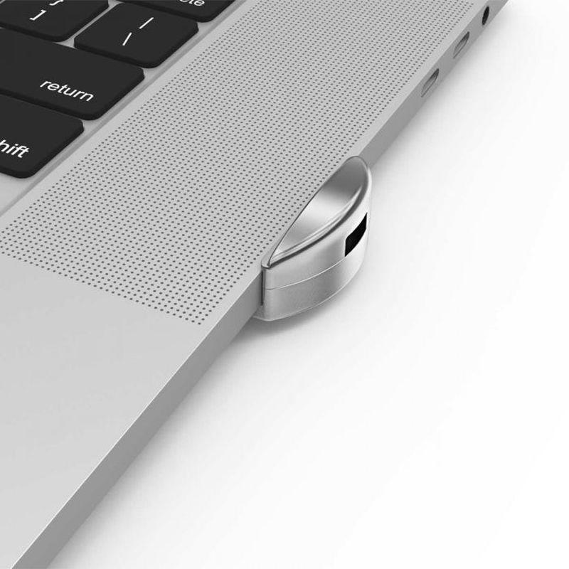 COMPULOCKS Ledge Adapter MBP16 securely mounted on a MacBook Pro 16, showcasing its robust design and compatibility.