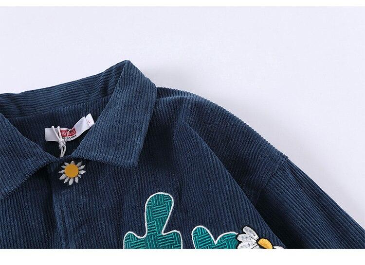 Men's corduroy jacket featuring daisy flowers and letter embroidery, showcasing a loose fit and retro style.